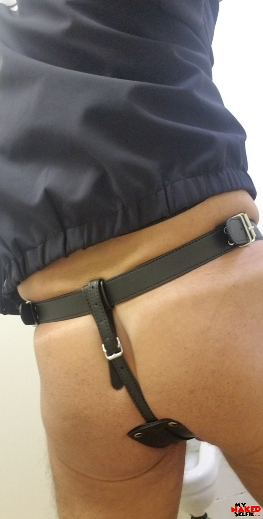 Cop in a dildo harness