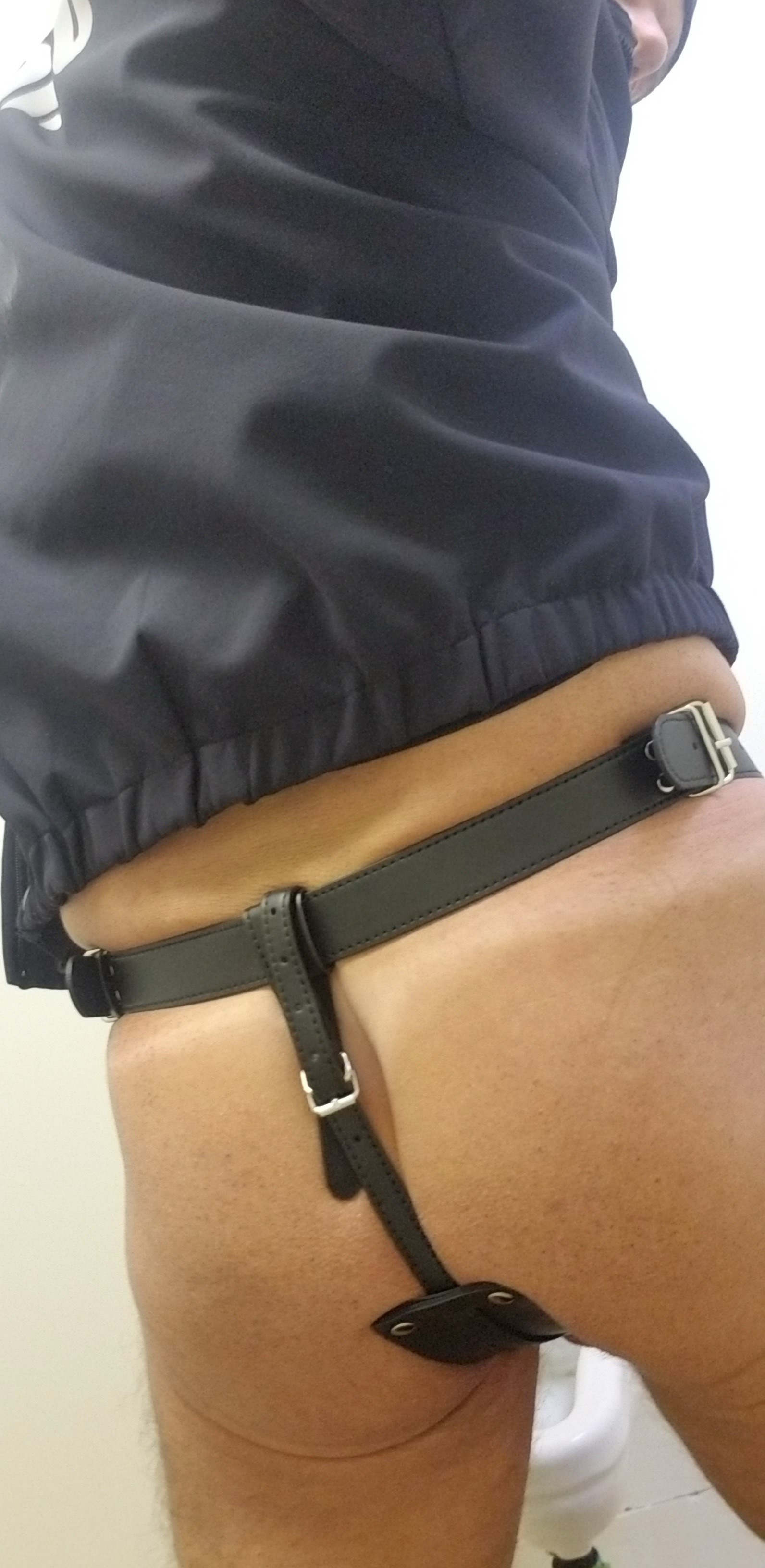 Cop in a dildo harness