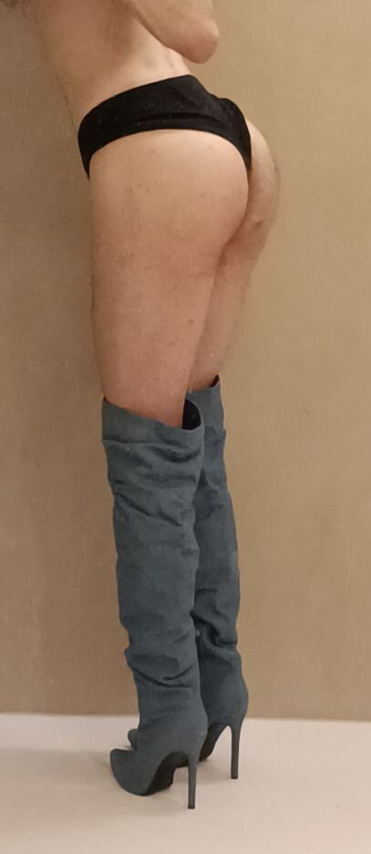 Whore's ass in heeled thigh-high boots