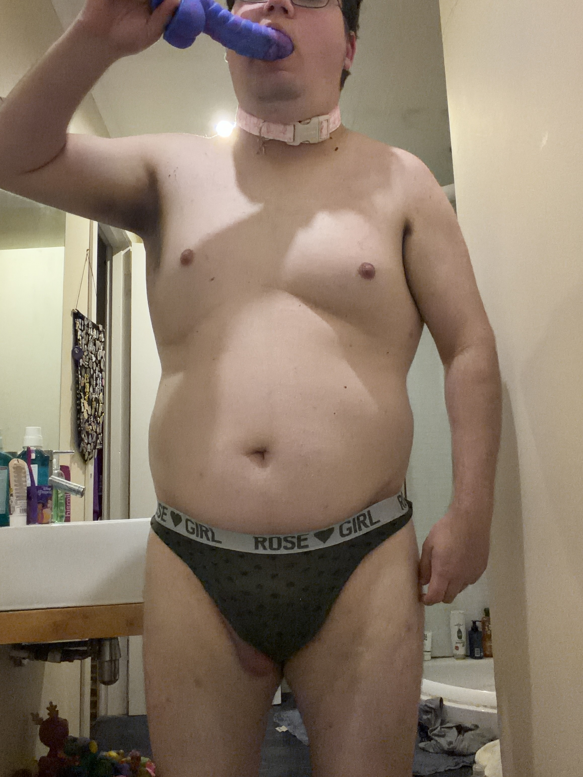 Slave playing with another dildo
