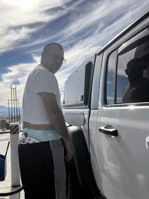 Diaper boy pumping gas