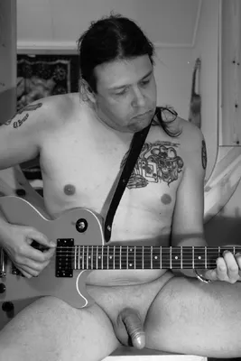 Nude guitar player